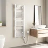 A modern bathroom with a white electric towel radiator mounted on the wall.