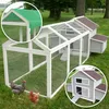 A large wooden chicken coop with a run, set up on a grassy lawn with two chickens in the foreground. The image includes close-up insets of the coop's roof and a detailed view of the coop's structure. Produktbild-Vorschau