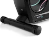 A close-up view of the base of a black recumbent exercise bike, showing a roller wheel. Produktbild-Vorschau