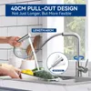 A kitchen faucet being used to rinse vegetables in a sink. Produktbild-Vorschau