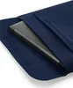 A laptop is partially inserted into a navy blue felt sleeve. Anteprima dell’immagine prodotto