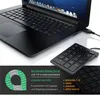 A black USB numpad is connected to a black laptop, with marketing text and graphics in the foreground. Voir les images du produit