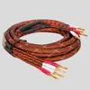 A coiled pair of speaker cables with banana connectors. Podgląd zdjęcia produktu