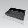 A black barbecue grill with a silver grill grate placed on top. Anteprima dell’immagine prodotto