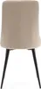 The back view of a beige upholstered dining chair with black metal legs. Podgląd zdjęcia produktu