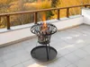 A fire pit on a balcony with autumn trees in the background. Produktbild-Vorschau