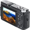 A black digital camera is shown from a rear-diagonal angle, displaying a scenic landscape on its screen. Náhľad obrázku produktu