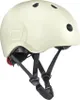 A cream-colored helmet with black straps and a red light on the back. Náhled obrázku produktu