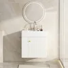A white vanity cabinet with a sink and faucet is mounted on a marble-tiled wall. Podgląd zdjęcia produktu