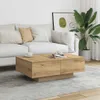 A living room scene with a couch, coffee table, and plant. Voir les images du produit