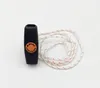 A black starter handle with an orange STIHL Elastostart logo and a white and red cord on a white background. Voir les images du produit