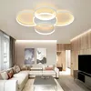 A modern living room with a sectional sofa, coffee table, and a large TV. Voir les images du produit