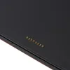 A close-up view of a black surface with a row of gold pins. Anteprima dell’immagine prodotto