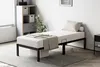 A bedroom setting with a bed, nightstand, and storage unit. Voir les images du produit
