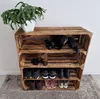 A wooden crate shoe rack with shoes and accessories. Náhled obrázku produktu
