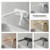 A collage of different colored bathroom faucets mounted on a wall above a sink. Podgląd zdjęcia produktu
