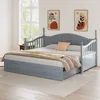 A gray daybed with storage drawers is shown in a room with two abstract art pieces on the wall and a large window in the background. Produktbild-Vorschau