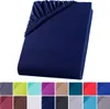 A folded dark blue fitted sheet is shown against a white background. Below the sheet are swatches of various colors, likely representing other available colors for the product. Produktbild-Vorschau