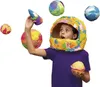 A child wearing a homemade astronaut helmet and holding planet-like objects. Produktbild-Vorschau