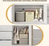 Two views of a white wardrobe interior, one showing storage bins and clothes on hangers, the other showing drawers and more clothes. Náhled obrázku produktu