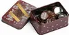 A tin box filled with bottle caps, some of which are chocolates, on a white background. Podgląd zdjęcia produktu
