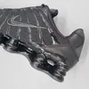 A close-up side view of a black Nike Shox TL sneaker. Produktbild-Vorschau