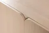 A close-up view of the curved edges of two wooden cabinet doors meeting at a seam. Produktbild-Vorschau