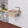 A utility sink and storage bins are mounted on a concrete wall in a workshop or garage setting. Anteprima dell’immagine prodotto