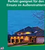 A house at dusk with exterior lights on, and text overlay. Produktbild-Vorschau