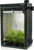 A grow tent with plants inside, illuminated by a grow light. Podgląd zdjęcia produktu