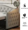 A close-up view of a tufted gray sofa bed with a USB charging port and a small inset image showing the fabric texture. Produktbild-Vorschau