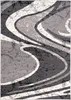 A close-up view of a rug with a modern abstract design. Produktbild-Vorschau