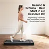 A woman is walking on a treadmill in a room. Produktbild-Vorschau
