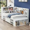A white bed with integrated shelving and storage, set in a child's bedroom with a blue wall and a window overlooking greenery. Podgląd zdjęcia produktu