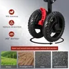Close-up of the wheels of a foldable trolley, with text and icons highlighting features and different terrains it can be used on. Produktbild-Vorschau