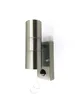 A silver outdoor wall light with a motion sensor is mounted on a white wall. Produktbild-Vorschau
