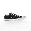A black Converse All Star shoe is shown from the side against a white background. Voir les images du produit