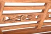 A close-up view of the carved wooden detail on a bench. Produktbild-Vorschau