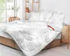 A neatly made bed with white bedding, pillows, and a duvet, set in a bright room with a large window and wooden shelves. Podgląd zdjęcia produktu