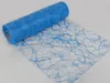A roll of blue decorative mesh fabric with a swirling pattern, partially unrolled on a white surface. Produktbild-Vorschau