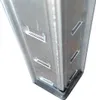 A close-up view of the corner of a metal shelf unit, showing the connection points and a black plastic foot. Produktbild-Vorschau