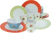 A collection of ceramic plates, bowls, and mugs with polka dot and floral patterns, arranged on a white background. Produktbild-Vorschau