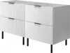 A white cabinet with a fluted front and black legs, shown from a three-quarter angle.