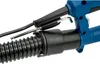 Close-up view of the connection between a flexible hose and a blue power tool. Náhled obrázku produktu