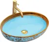 A countertop sink with a gold faucet. Náhľad obrázku produktu