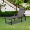 A gray chaise lounge is placed on a green lawn in front of a white staircase with lush green plants. Produktbild-Vorschau