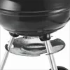A close-up view of the bottom section of a black charcoal kettle grill, showing its legs and a metal ash catcher. Produktbild-Vorschau