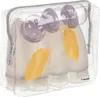 A clear, well-lit studio shot of a set of travel-sized refillable bottles inside a transparent toiletry bag. Produktbild-Vorschau
