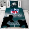A bed with NFL-themed bedding featuring American football players and the NFL logo. Produktbild-Vorschau