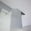 A close-up view of a modern shower head and panel in a bathroom. Podgląd zdjęcia produktu